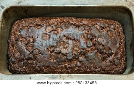 A Delicious Freshly Baked Chocolate Chip Cake Baked In A Tin.