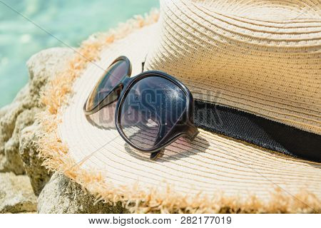 Female Accessory, Straw Sunhat, Sun Glasses On Beach. Summer Bearch Vacation