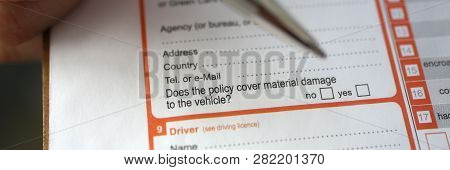 Male Insurer Hand Hold Silver Pen An Accident Europrotocol Closeup. Risk Transportation Representati