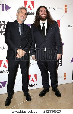 LOS ANGELES - FEB 1:  Alfonso Cuaron, Adam Gough at the 69th Annual ACE Eddie Awards at the Beverly Hilton Hotel on February 1, 2019 in Beverly Hills, CA
