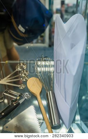 Cooking Utensils Used For Baking And Pastry Work Displayed In Glass Case.