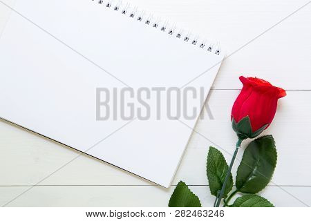 Present Gift With Red Rose Flower And Notebook On Wooden Table, 14 February Of Love Day With Romanti