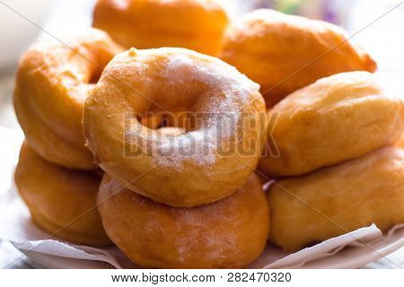 Hot Confectioners Have Just Been Sentenced And Laid Out On Dishes And Sprinkled With Powdered Sugar.
