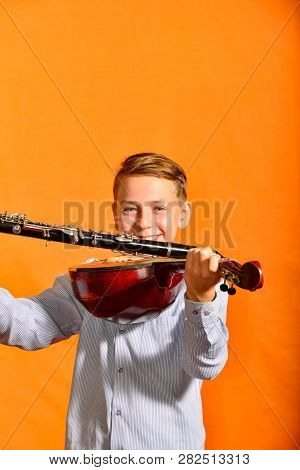 Handsome Boy Trying To Play The Dombra.