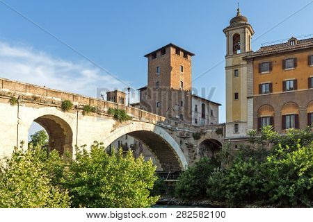Rome, Italy - June 22, 2017: Cityscape With Castello Caetani, Tiber River And Pons Fabricius In City