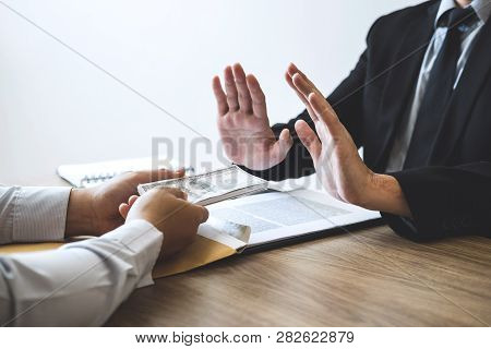 Anti Bribery And Corruption Concept, Business Man Refusing And Don't Receive Money Banknote Offered 