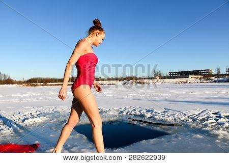 Young Woman Crosses Herself Plunging Into Icy Water During Ukraine
