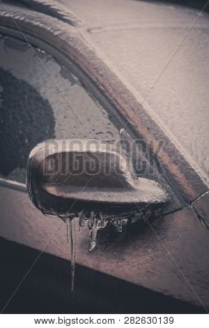 Close Up Shot Of A Frozen Car Mirror After Freezing Rain.
