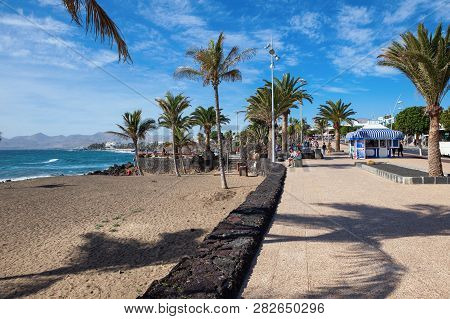 Puerto Del Carmen, Lanzarote - 23 December 2018. Beach, Blue Sea, Palm Trees, Selective Focus