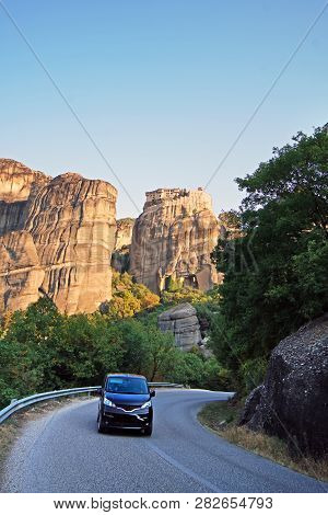 Tourists Driving Around In The Streets Of Meteora,greece