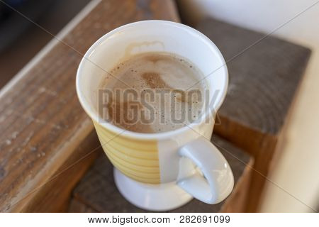 Cup Of Coffee On A Wooden Table