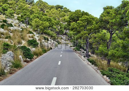 Open Coastal Road Winding Through To Lighthouse Cap Formentor
