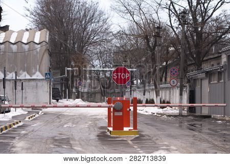 Striped Barrier. Two Slagbaum And Sign Traffic Without Stopping Is Prohibited.