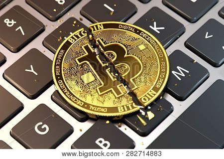 Cracked Or Damaged Bitcoin Is Laying On Keyboard. Paying Ransom With Bitcoin Concept. 3d Rendering