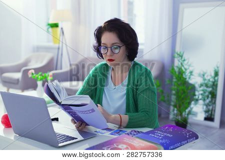 Nice Smart Brunette Woman Studying Deeply Numerology