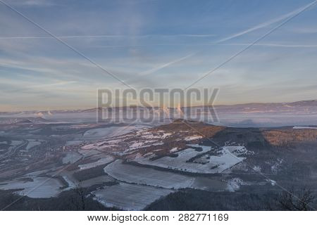 Sunrise On Boren Hill Near Bilina Town In Winter Frosty Color Morning