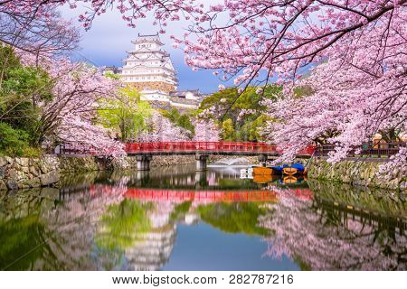 Himeji, Japan at Himeji Castle's surrounding moat in the spring season. 