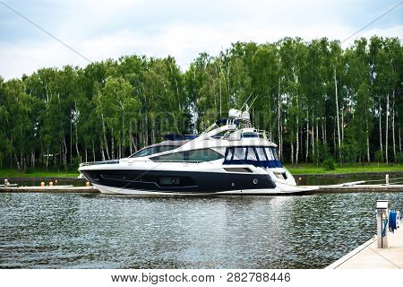 Luxury Large Motor Yacht Moored To The Pier Of The Yacht Club Off The Coast