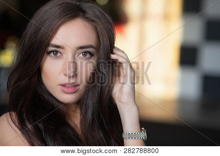 Portrait Of A Addorable Young Woman Posing In Studio