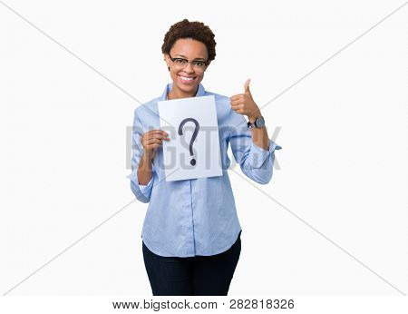 Young african american woman holding paper with question mark over isolated background happy with big smile doing ok sign, thumb up with fingers, excellent sign