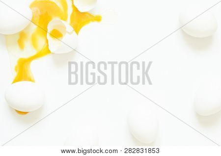 Eggs.  Eggs Fresh, Unharmed And One Broken Egg With Yellow Yolk On A White Background. Healthy Eatin