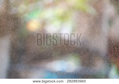 Blurred Many Small Spraying Droplets In The Air On Outdoor Space For Background Backdrop