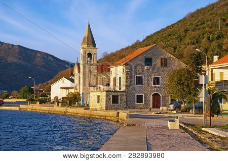 Sunny Winter Day In Mediterranean Village. Montenegro, Tivat.  View Of Donja Lastva Village And Cath