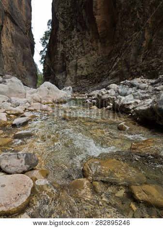 Crystal Clear Water Of A Cold Mountain Creek At Rocky Terrain Of Samaria Gorge, South West Part Of C