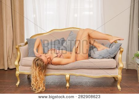 Beautiful Caucasian Blonde Girl In Pink Lace Lingerie