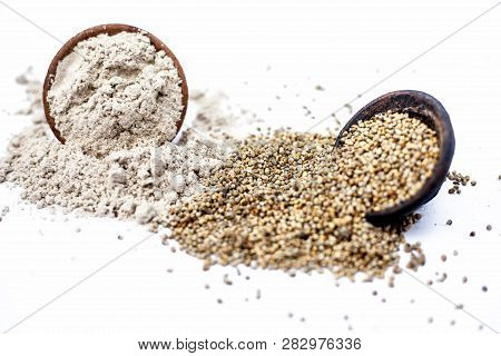 Close Up Of Clay Bowl Of Barley Or Pearl Millet With Its Flour In A Another Bowl Isolated On White.