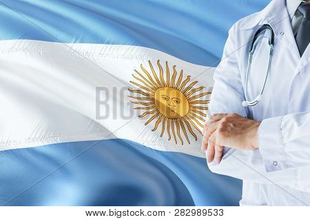 Argentinean Doctor Standing With Stethoscope On Argentina Flag Background. National Healthcare Syste
