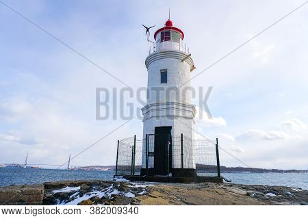 Lighthouse Tokarevskiy Egersheld On Tokarevskaya Koshka Cape In Vladivostok, Primorsky Krai In Russi