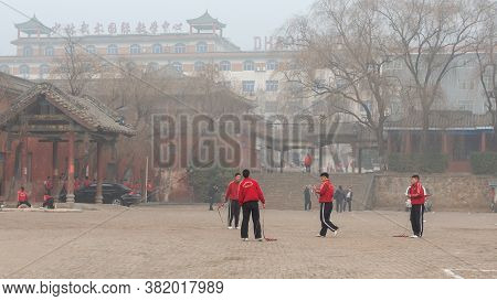 Shaolin, Luoyang, Henan Province / China - January 4, 2016: Young Apprentices Train In The Yard Of S