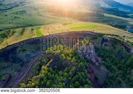 Aerial view of  Racos volcanic crater in the sunrise, Brasov county, Romania 