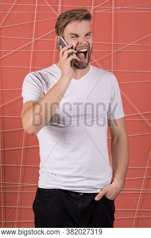 Rude Manners Concept. Guy Call Phone Mobile Conversation. Macho Aggressive Mad Shouting Face Speak P
