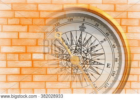 Abstract Photo With Compass On Brick Wall Background As Symbol Of Tourism With Compass, Travel With 