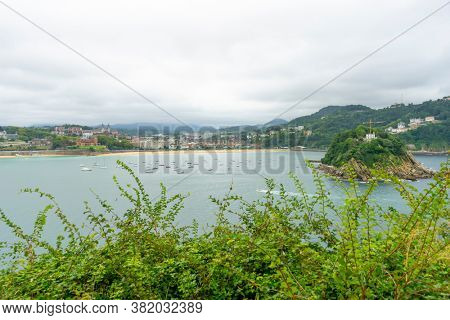 Holiday, view of the city of San Sebastian, with La Concha beach, from Mount Urgull. Summer vacation scene in Spain