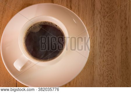 Hot Americano Coffee With A Little Foam And Smoke.