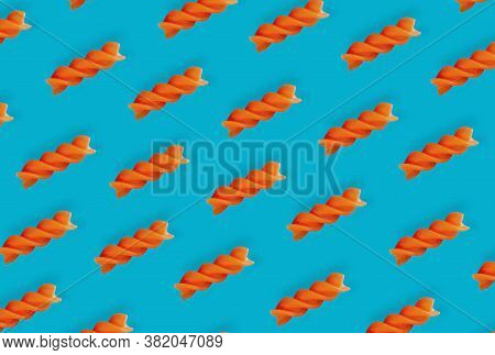 Diagonal Spiral Paste On A Blue Background, Top View, Italian Dish, Symmetrical Layout, Gluten-free 