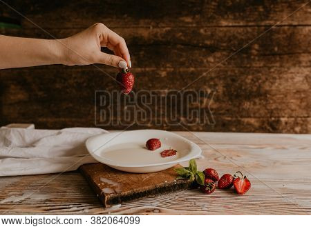 Juicy Red Strawberry Lies On The Wooden Board