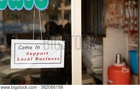 Come In Support Local Business Signage Attached Infront Of Door During Coronavirus Or Covid-19 Pande
