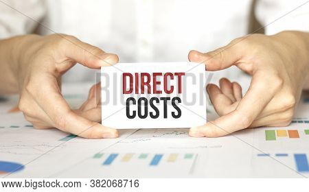 Businesswoman Holding A Card With Text Direct Costs