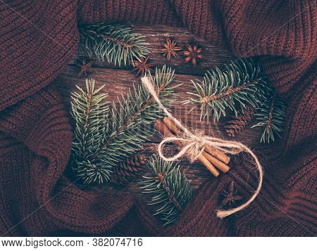 Cosy And Soft Winter Background In Warm, Trendy Colors. Christmas Composition Of Spruce Branches, Kn