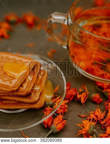 The Honey On Baked Goods. Orange Calendula Flower Tea