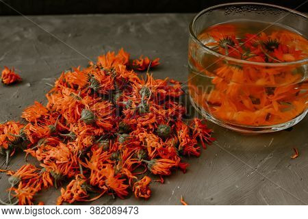 Flower Light Tea In A Transparent Large Cup, Orange Calendula.