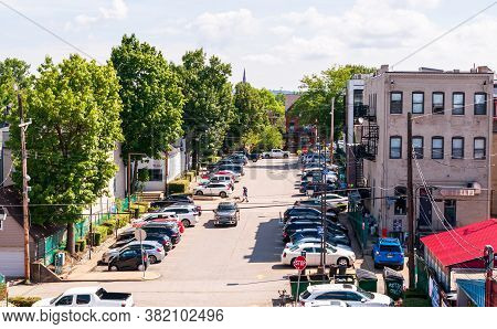 Pittsburgh, Pennsylvania, Usa 8/23/20 Looking Down On To A Street That Goes Through A Public Parking