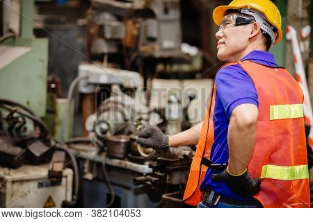 Factory Workers Tired And Inflame Back Muscle From Hard Work.factory Labor With Lower Back Pain Symp