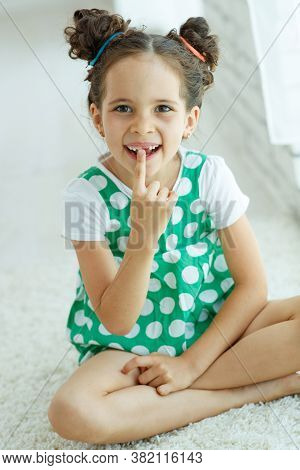 Little Girl With No Tooth. The Child Lost A Tooth. High Quality Photo.