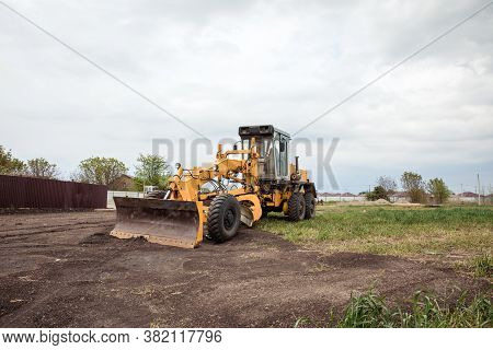 Yellow Bulldozer With Bucket. Wheel Loader. Heavy Equipment Machine. Tractor Front Loader. Construct