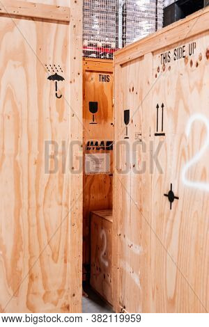 Wooden Boxes In The Warehouse. Boxes Out Of Wood For Packing Industrial Machinery. Warehousing. Pack